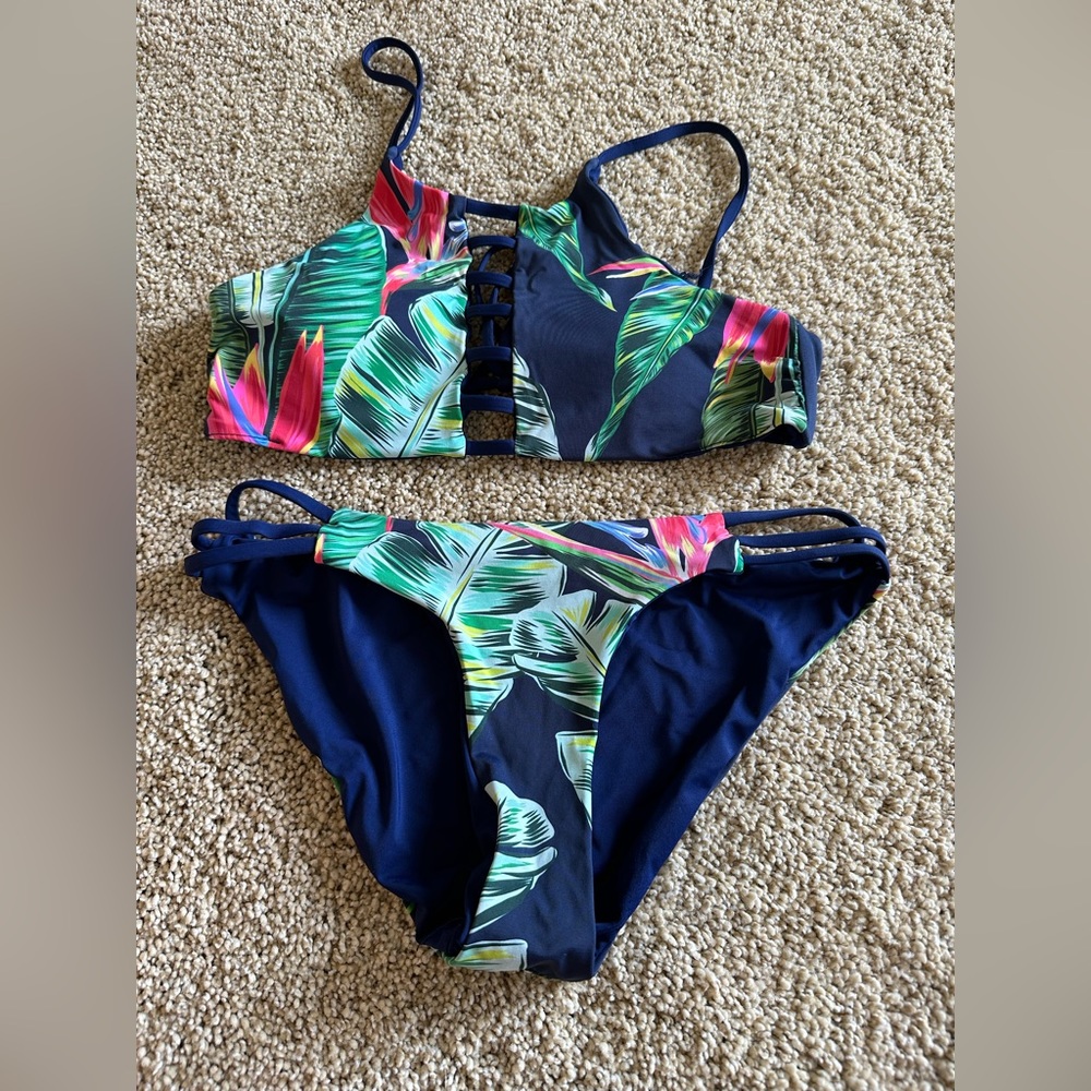 Reversible bikini, navy blue and beachy floral, size small.